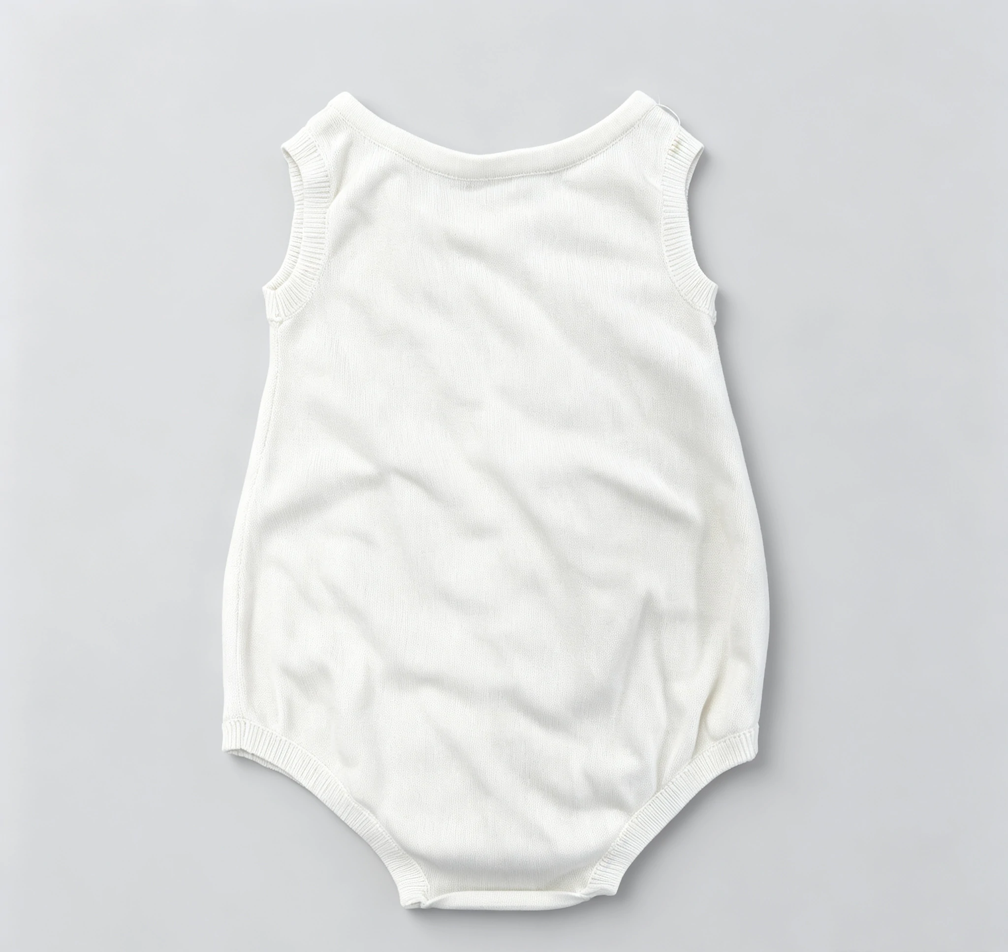 Solid White Sleeveless Knit Baby Bodysuit 2 Solid White Sleeveless Knit Baby Bodysuit - Image 2